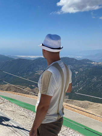 Young woman standing on viewing platform.の写真素材