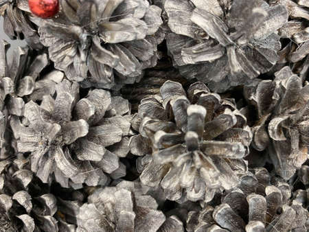 Christmas tree made of silvery shiny Christmas balls and cones with a star made of air-dry clay, horizontal background, figure of a Christmas tree made selective focus.の写真素材