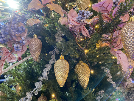 Happy New Year and Merry Christmas background with fir tree branches and toys and garlands....