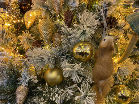 Happy New Year and Merry Christmas background with fir tree branches and toys and garlands. Holidays.の写真素材
