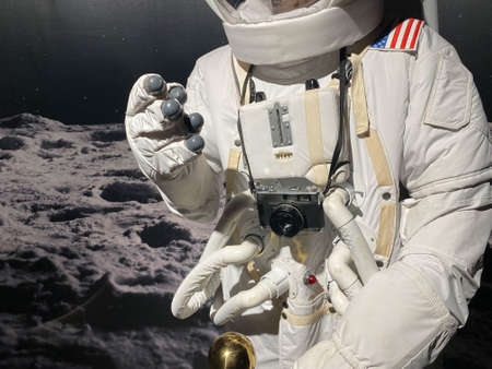 Astronaut with a camera makes a photo.の写真素材