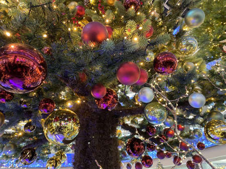 Decorated christmas tree on street with balls, toys.の写真素材