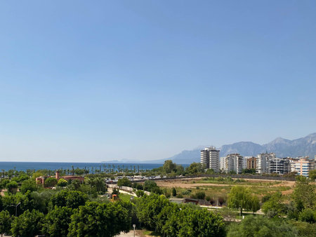 ariel panoramic view of old city and skyscrapers with the sea from the mountains.の写真素材