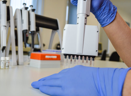 close up. female scientist examining a liquid in a laboratory flask.