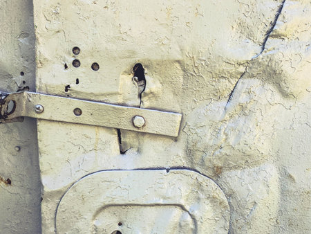 metal texture. homemade door to a poor dwelling. metal booth, door lock made by hand. door painted...