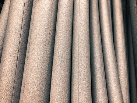 white foam rubber round shape, volumetric foam rubber for construction work. goods in a hardware store for insulation and insulation of pipes. foam pipe with insulation seal.の写真素材