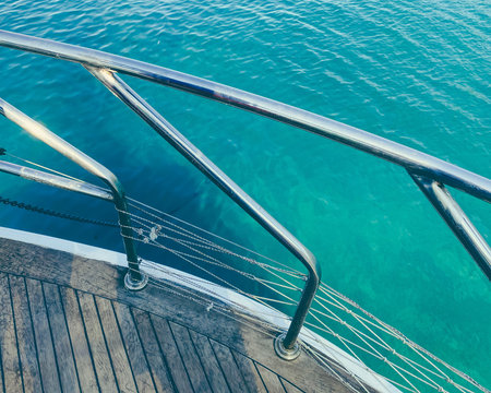 yacht in the open sea. sea with a sandy beach against the backdrop of a mountain. to protect...