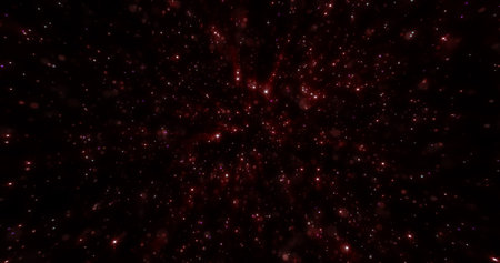Abstract red background of small round bokeh particles, beautiful holiday snowflakes, magical snow, energetic bright glowing cosmic stars.の写真素材