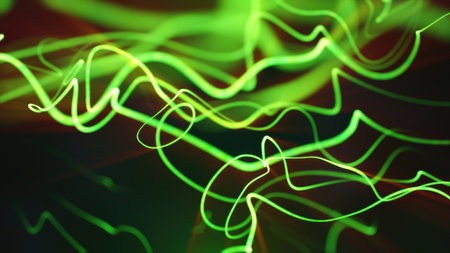 Bright neon green light trails curving and intersecting against a black futuristic backdrop.の写真素材