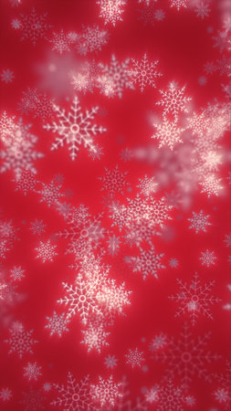 Festive red background with delicate white snowflakes falling in soft focus.の写真素材