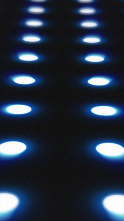 Blue illuminated circles in a grid pattern glowing over a dark surface, creating a futuristic LED...