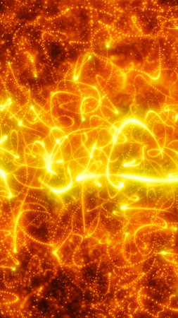 Abstract glowing golden fire particles swirling with intense energy and light on dark background.の写真素材