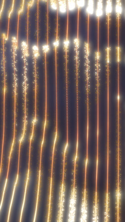 Abstract golden light trails with sparkling particles on dark background.
