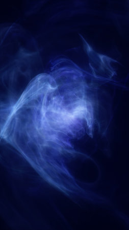 A swirling cloud of blue mist with hints of white, creating an ethereal and atmospheric effect. The smooth motion of the wisps suggests a sense of movement and fluidity.の写真素材