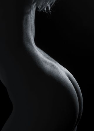 A beautiful nude young woman's butt in monochrome dark outlineの写真素材