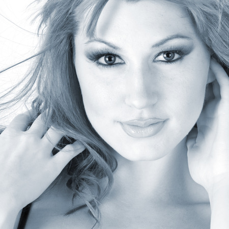 Beautiful woman in high key monochrome portraitの写真素材