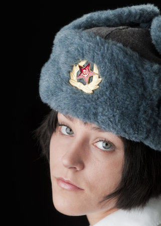 Beautiful brunette woman in Russian fur hat