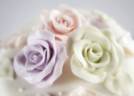 Beautiful wedding cake with rose icing decorationsの写真素材