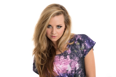 Beautiful blonde woman in purple top looking sexyの写真素材