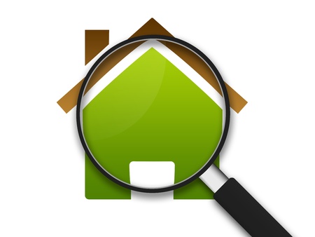 Magnifying Glass zooming in on a clipart house . の写真素材