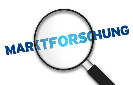 Magnifying Glass with the word Market Research on white background.の写真素材