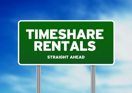 Green Timeshare Rentals highway sign on Cloud Background. の写真素材