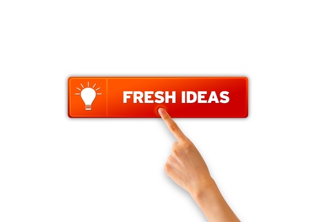 Hand pointing at orange fresh ideas icon の写真素材