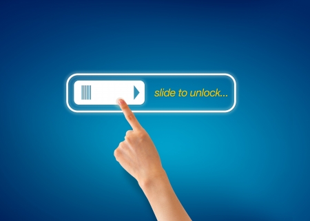 Hand pointing at a Slide To Unlock Icon on blue background.の写真素材