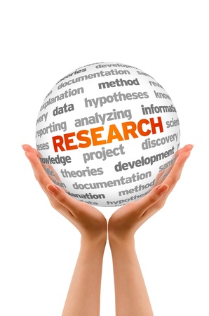 Hands holding a Research Word Sphere sign on white background.の写真素材