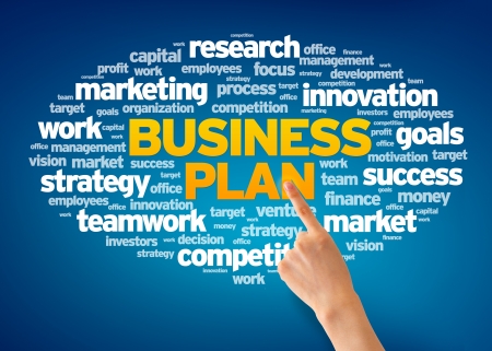 Hand pointing at a Business Plan Word Cloud on blue background.の写真素材
