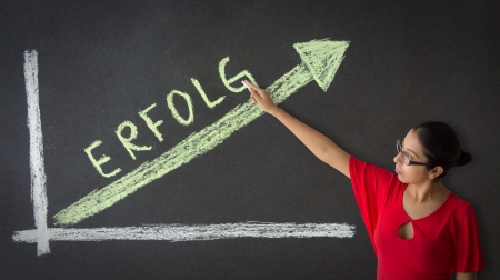 Woman pointing at an Success Business Graph illustration.の写真素材