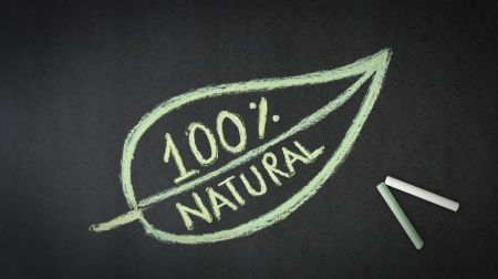 100 percent natural chalk illustration on black background.の写真素材
