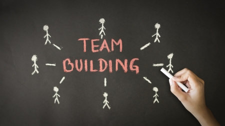 A person drawing and pointing at a Team building Chalk Drawingの写真素材