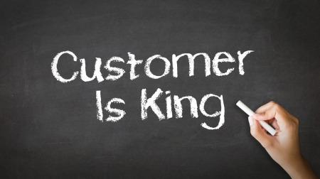 A person drawing and pointing at a Customer is King Chalk Illustrationの写真素材
