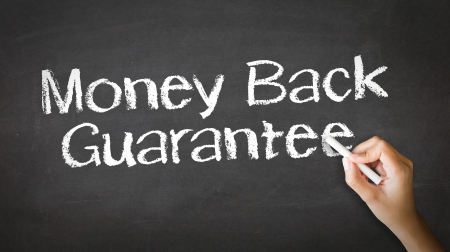 A person drawing and pointing at a Money Back Guarantee Chalk Illustrationの写真素材