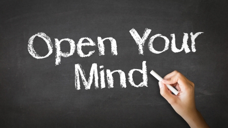 A person drawing and pointing at a Open Your Mind Chalk Illustrationの写真素材