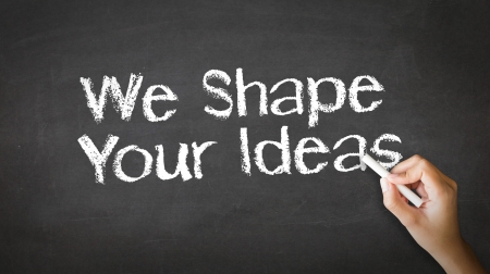A person drawing and pointing at a We Shape Your Ideas Chalk Illustrationの写真素材