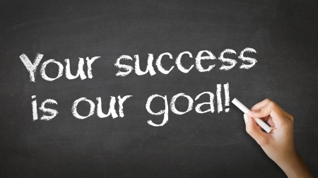 A person drawing and pointing at a Your Success is our goal Chalk Illustrationの写真素材