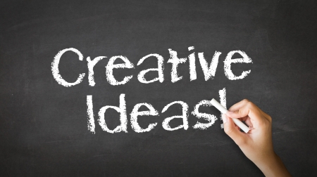 A person drawing and pointing at a Creative ideas Chalk Illustrationの写真素材
