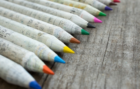 Old pencil with chinese characters on wooden background の写真素材