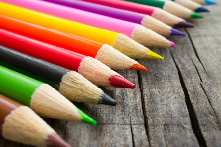 A Closeup of colorful  pencils on wood backgroundの写真素材