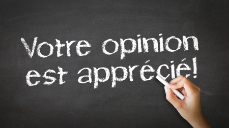 A person drawing and pointing at a We Want Your Feedback Chalk Illustrationの写真素材