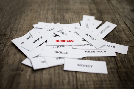 Paper strips with Business Concept related words on wooden backgroundの写真素材