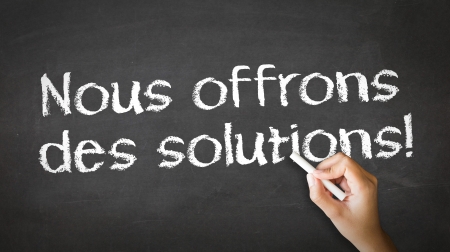 A person drawing and pointing at a We offer Solutions Chalk Illustrationの写真素材