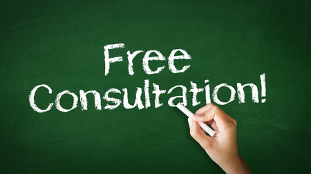 A person drawing and pointing at a Free Consultation Chalk Illustrationの写真素材