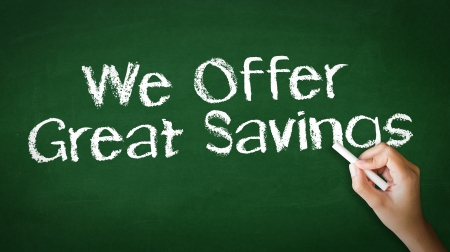 A person drawing and pointing at a We offer Great Savings Chalk Illustrationの写真素材