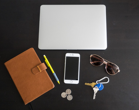 Business office workspace with Various items isolated on a black desk backgroundの写真素材