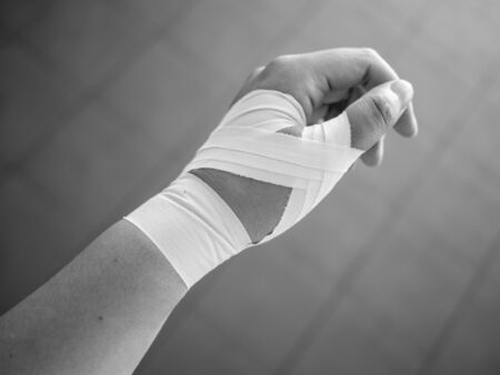 Black and white version of Thumb tape job for a thumb sprainの写真素材