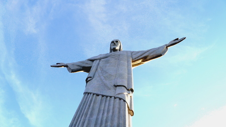 Statue of Christ the Redeemer, one of the seven wonders of the world of Open Arms on Guanabara Bay in Rio de Janeiro, Brazil on a sunny winter dayのeditorial素材