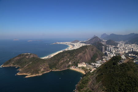 Sea landscape Sugar Loaf, Babylon and Urca Hill overlooking Copacabana beach one of the most famous beach in the world, one of the postcards of Rio de Janeiro on a sunny winter dayの写真素材